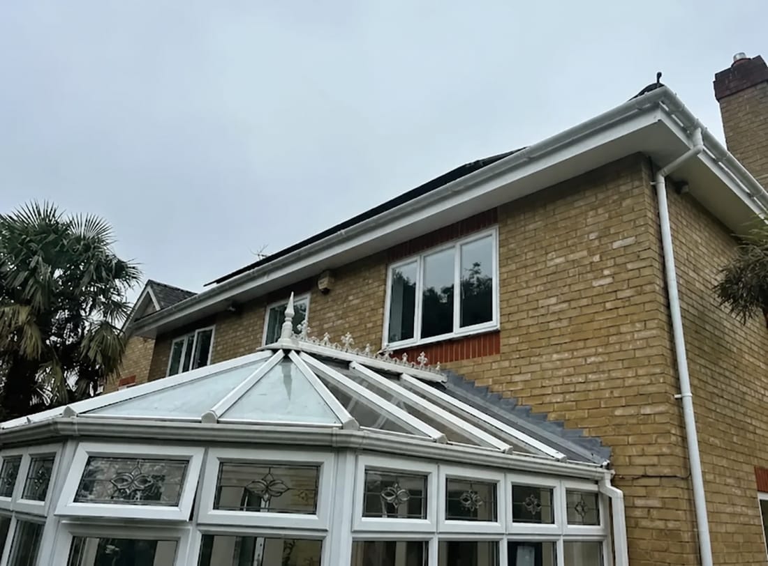 New white uPVC fascia, soffit and guttering fitted along a roofline